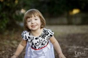 little-girl-smiling-deranium-dress