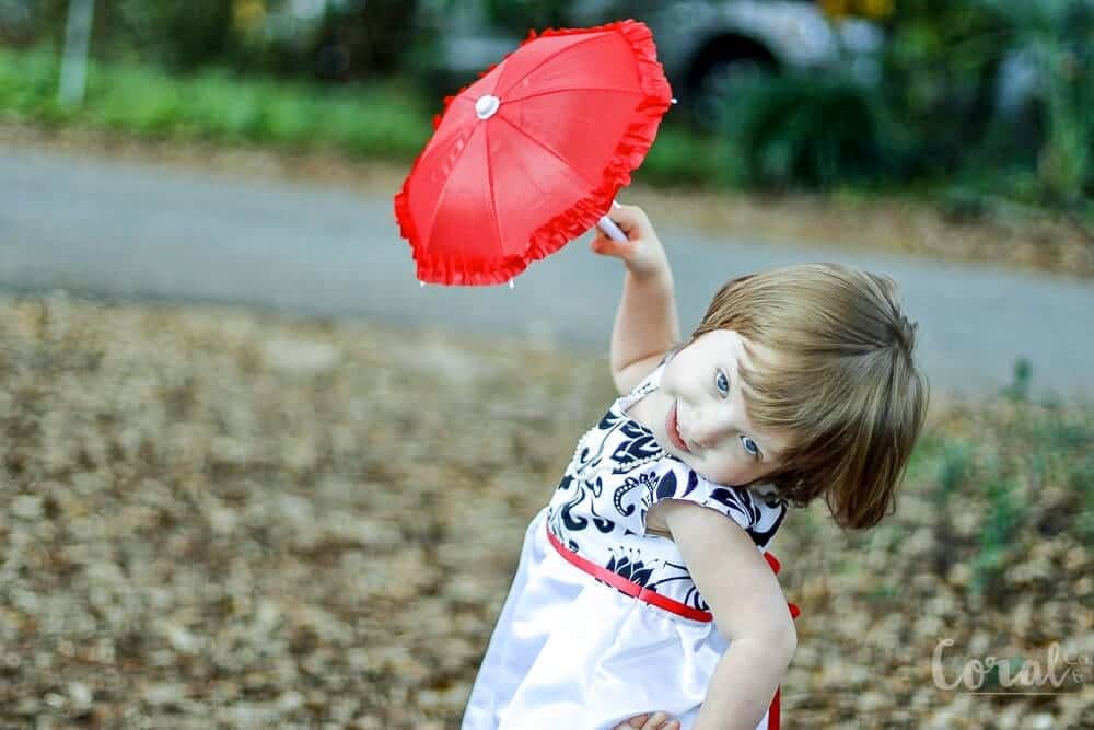 red-umbrella-little-girl-twirling